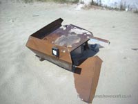 Air conditioning unit, now united with the sandy beach below its original home